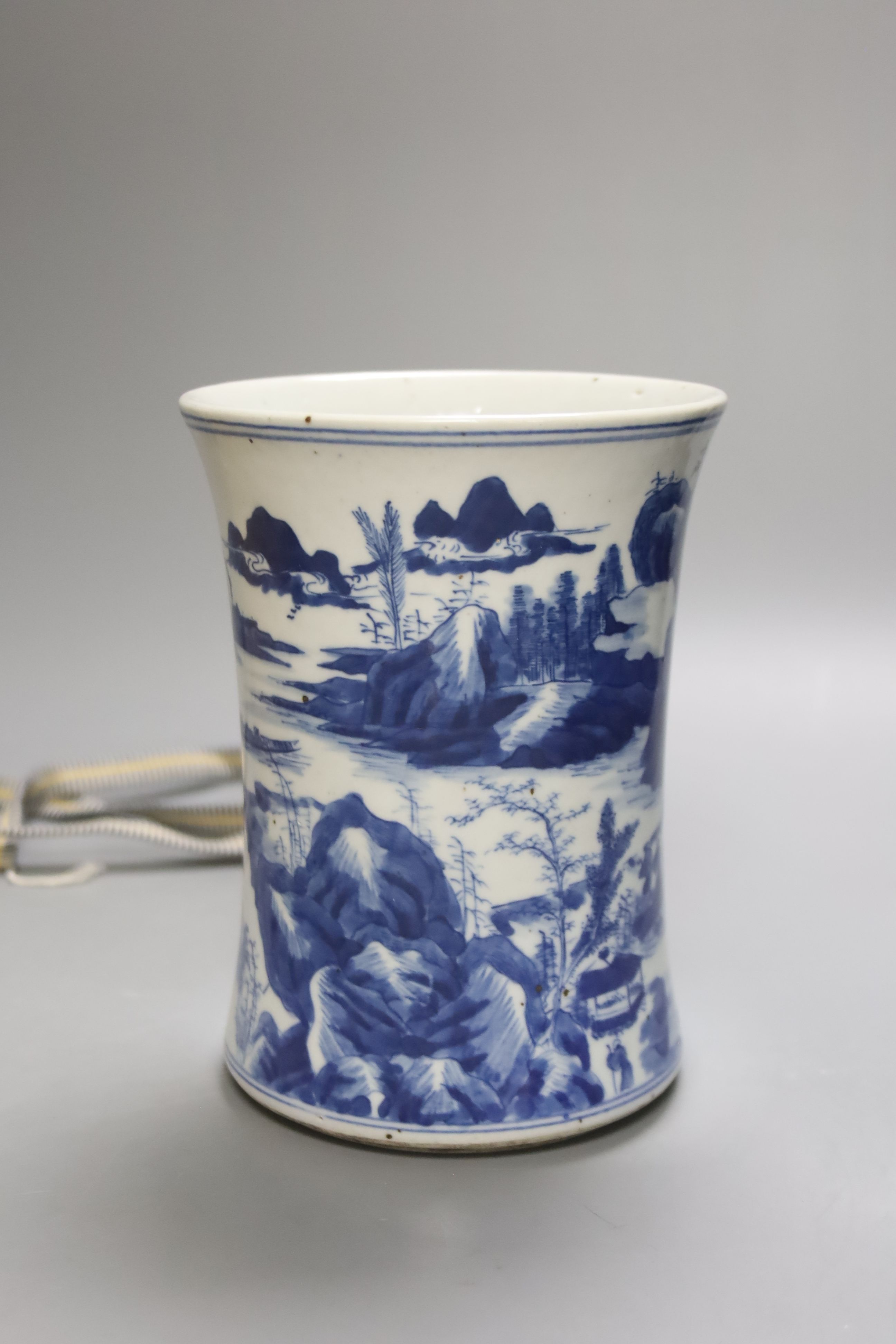 A Chinese blue and white porcelain brush pot, painted with a landscape, 17cm high, in later pine box